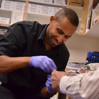 Student draws blood in lab
