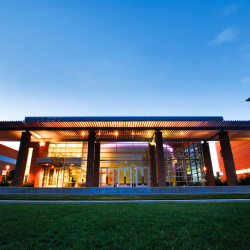 Fulginiti Pavillon at dusk with illuminated front side of the building